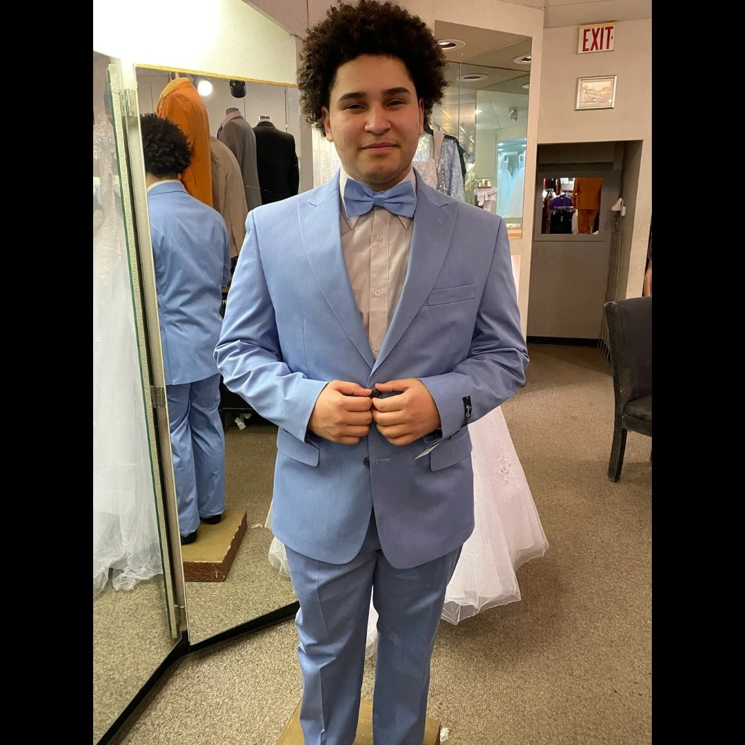 Client in light blue suit with matching bow tie