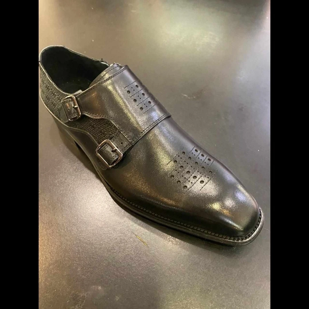 Black leather double monk strap dress shoe with brogue detailing