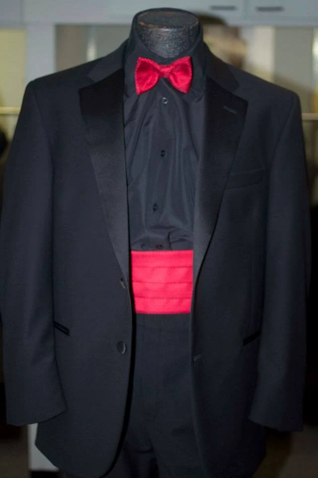 Black tuxedo with red bow tie and matching cummerbund