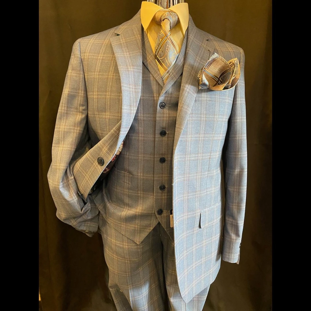 Grey plaid three-piece suit with gold accessories