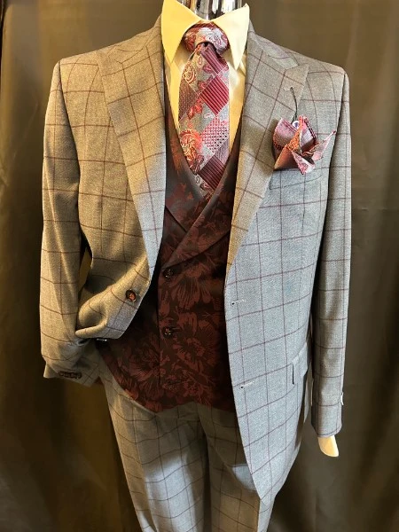 Grey windowpane three-piece suit with burgundy floral vest and patchwork tie