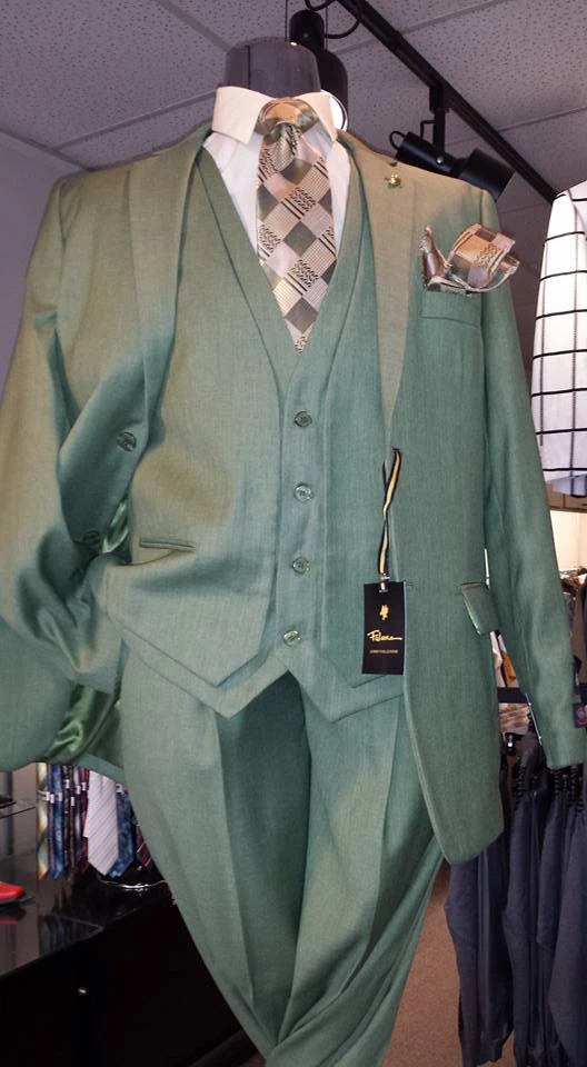 Sage green three-piece suit with plaid tie and matching pocket square