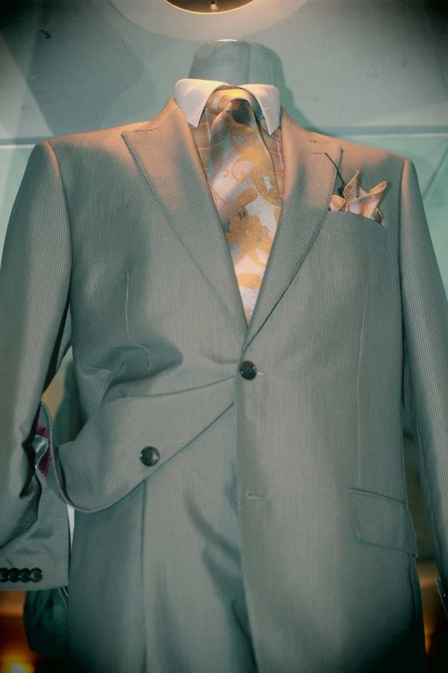 Sage green suit with gold baroque tie and matching pocket square