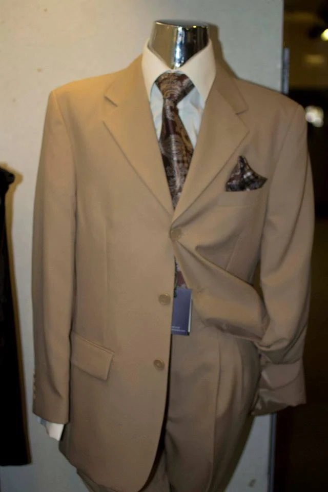 Tan beige suit with brown paisley tie and matching pocket square