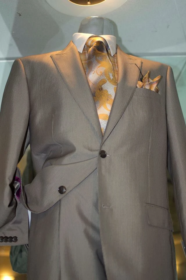 Tan grey suit with gold baroque tie and matching pocket square
