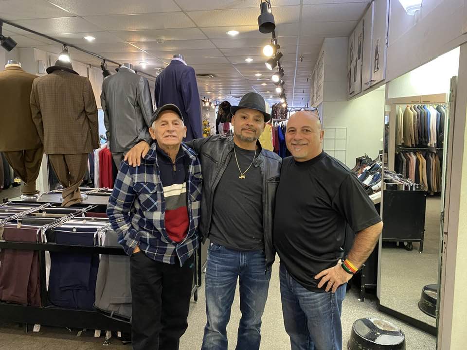 Customer being fitted for a champagne three-piece suit at Jack Green Men's Shop